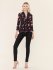 Top a fiori con scollo a V