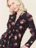 Top a fiori con scollo a V