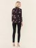 Top a fiori con scollo a V