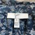 Blusa a fiori incrociata