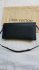 Pochette in pelle nera